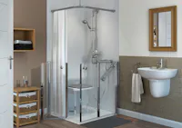 Compact disabled shower room layout with seated shower and supportive grab rails