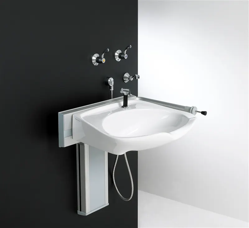 Height-adjustable rise and fall basin with wall-mounted taps for disabled bathroom use