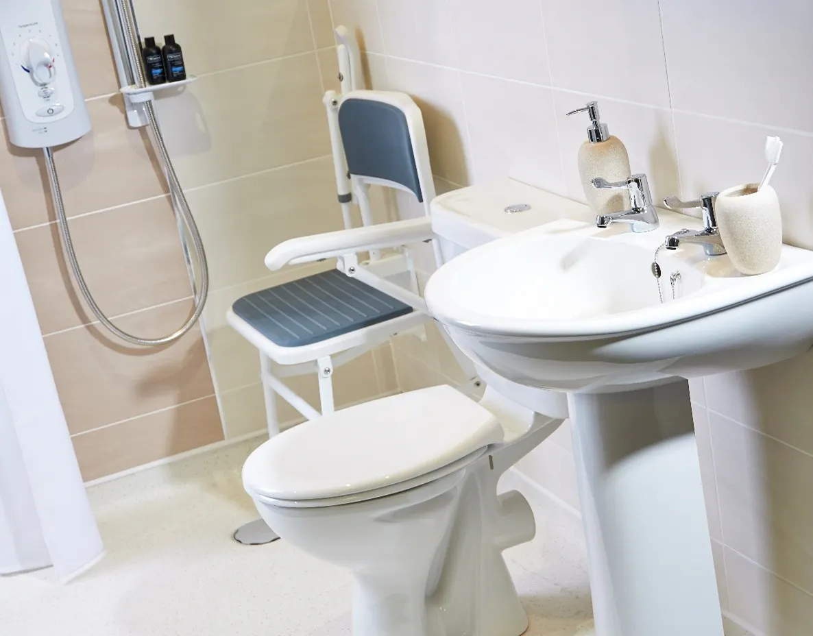 Wet room for disabled users with fold-down seat and level access entry