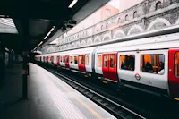 Discounted rail travel on London Underground train at a station platform with step-free tactile paving