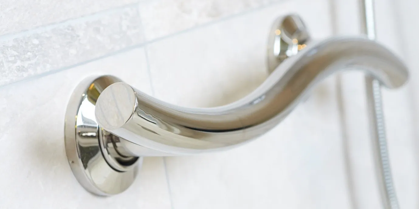Chrome bathroom grab rail professionally installed for additional safety and support