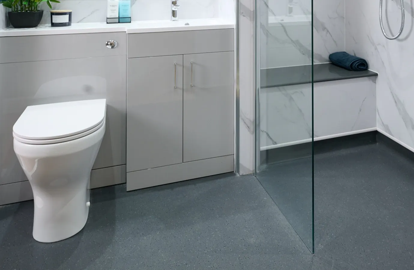 Accessible wet room with anti-slip flooring and integrated shower seating