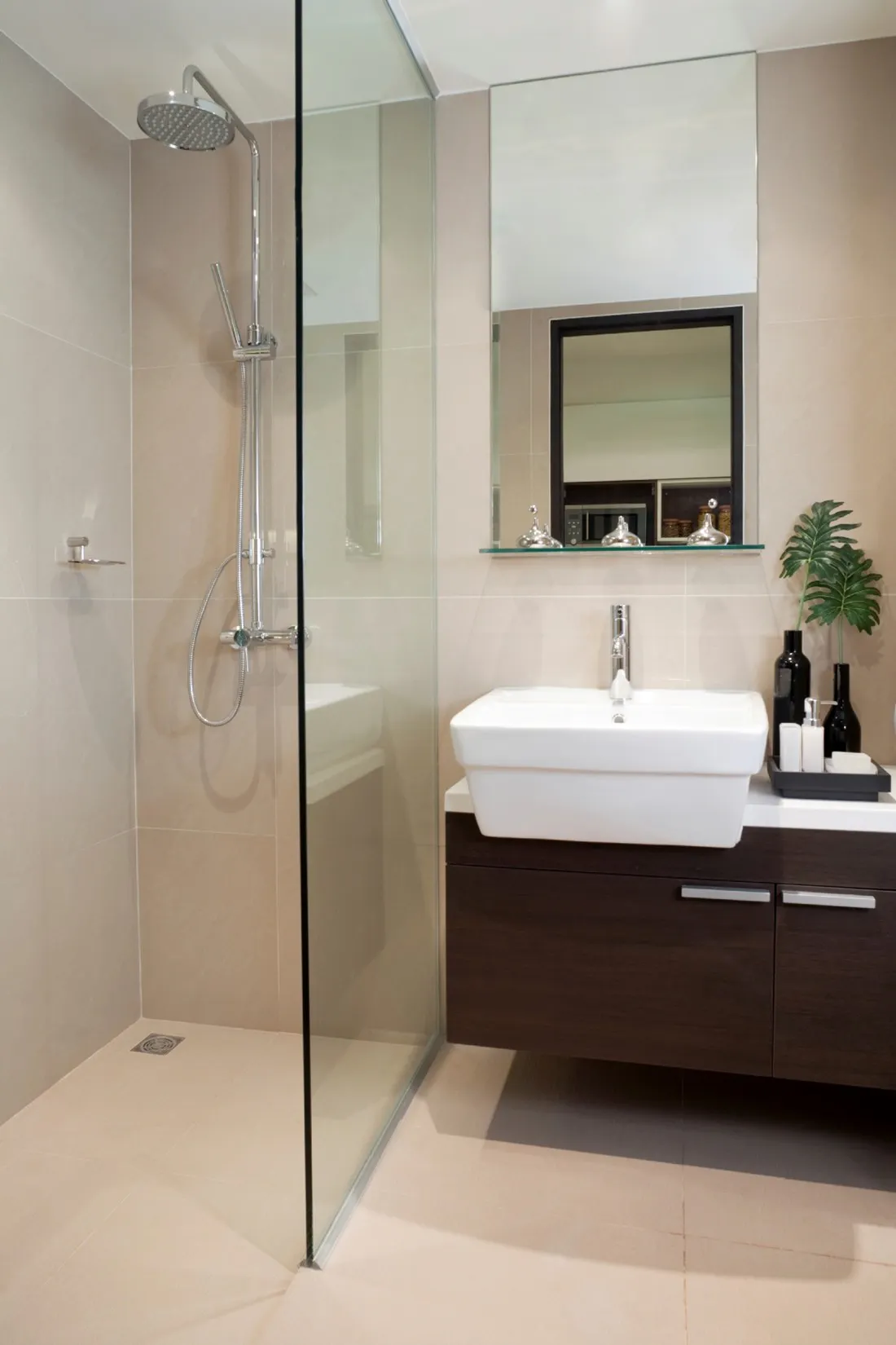 Small en-suite shower room with walk-in shower, wall-hung vanity unit and space-saving layout