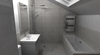 A tired and poorly designed bathroom was transformed into a stunningly modern, 4-piece bath and shower room solution