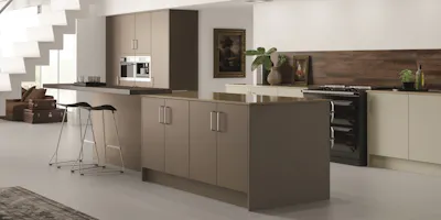 Open-plan contemporary kitchen featuring a large island, integrated appliances and neutral finishes.