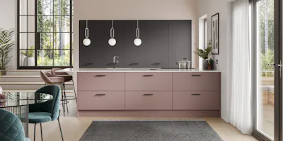 Contemporary kitchen with two-tone handleless cabinetry, statement island and pendant lighting.