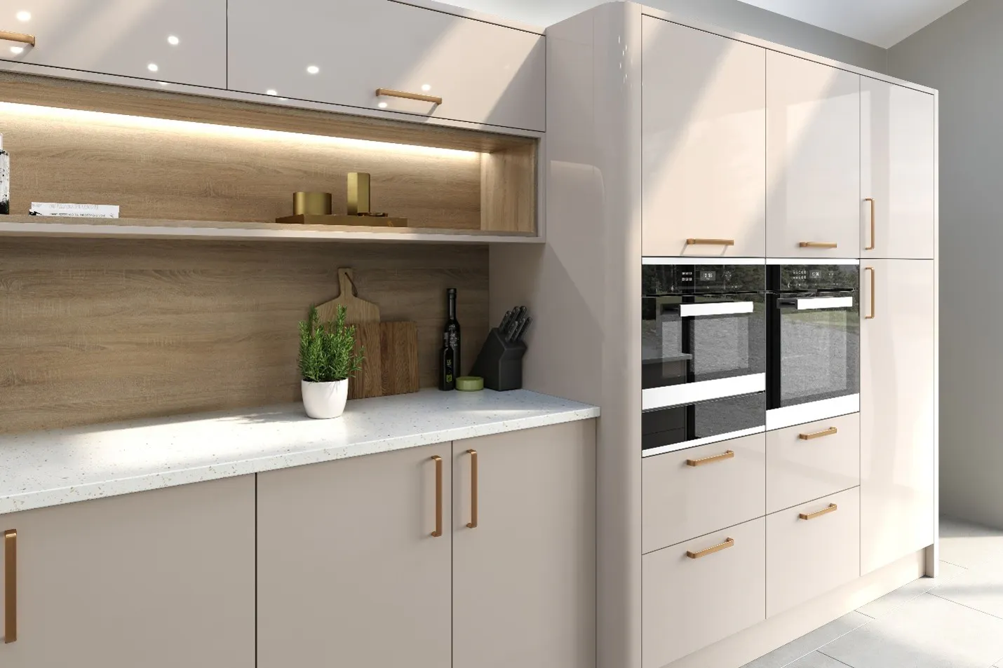 Contemporary cashmere handleless kitchen with integrated double ovens, quartz worktops and warm wood-effect feature shelving