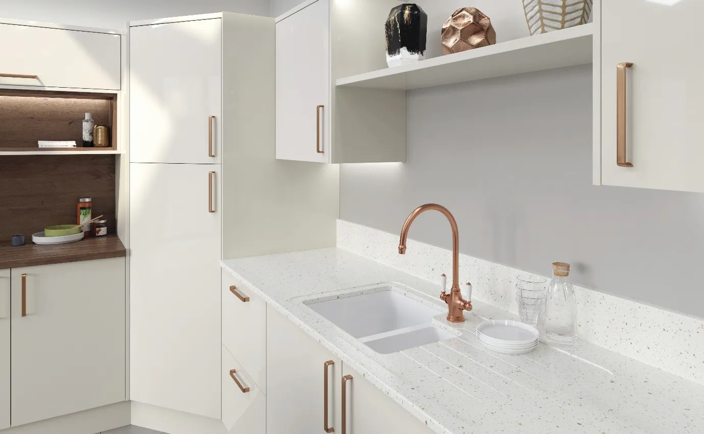 Contemporary L shaped kitchen with white units and copper tap detail
